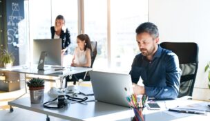 Employees working in open office area